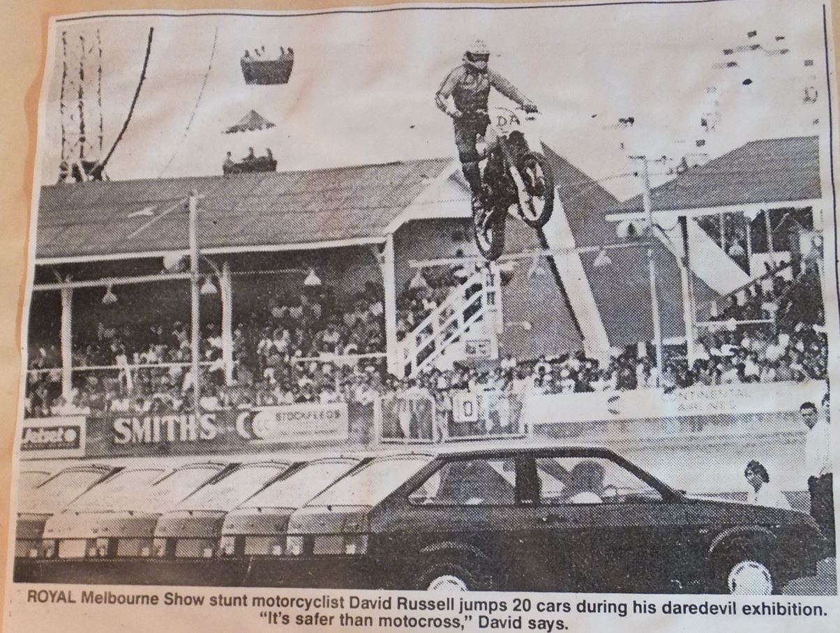 David Russell jumping over mini tanks.