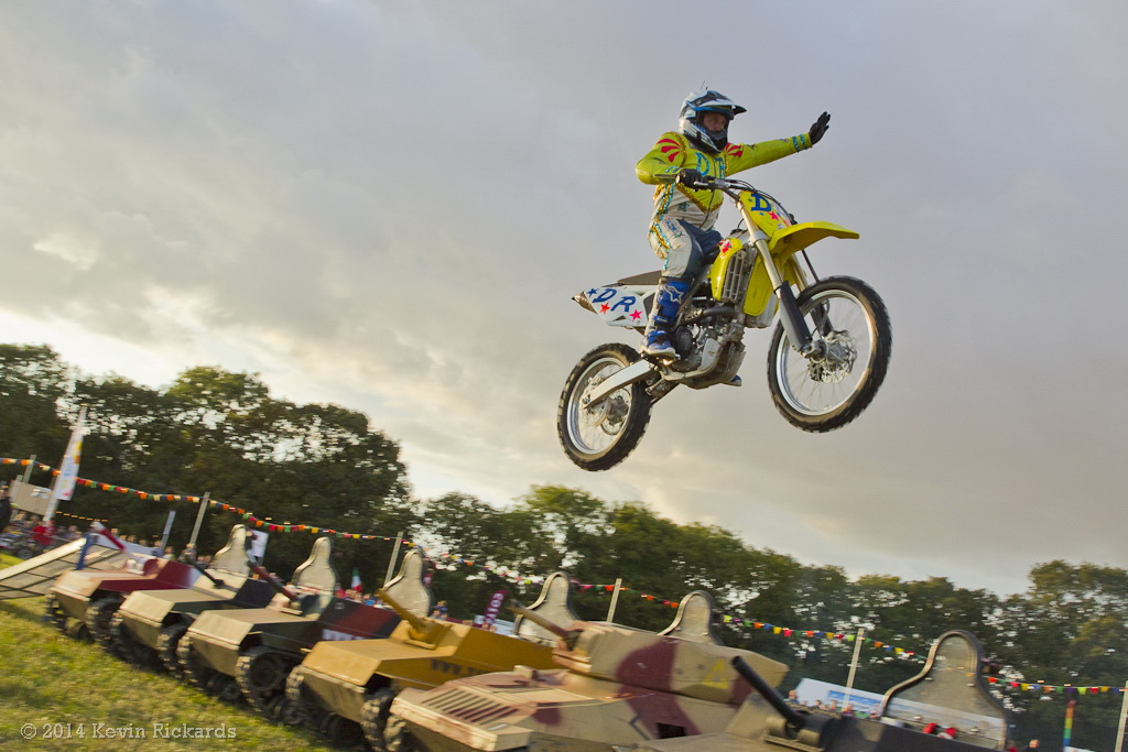 David Russell jumping over mini tanks.