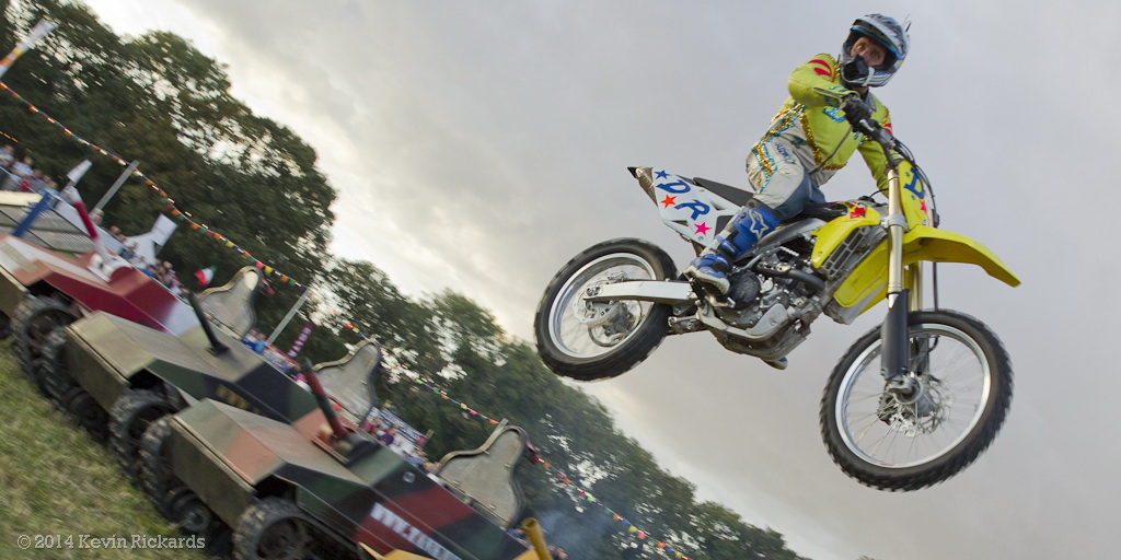 David Russell jumping over mini tanks.